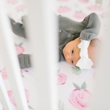 Copper Pearl&trade; Grace Premium Fitted Crib Sheet in Pink Flower. View a larger version of this product image.