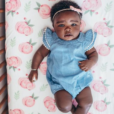 Copper Pearl&trade; Grace Premium Fitted Crib Sheet in Pink Flower. View a larger version of this product image.