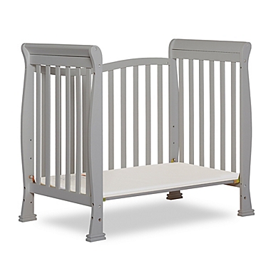 Dream On Me Piper 4-in-1 Convertible Mini Crib in Pebble Grey. View a larger version of this product image.