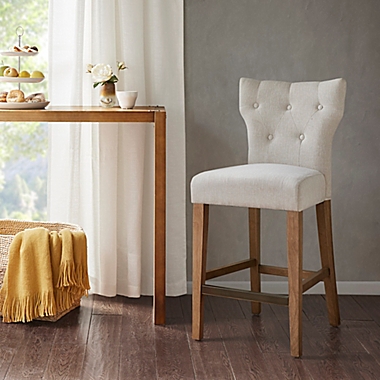 Madison Park Avila Tufted Back Counter Stool in Cream. View a larger version of this product image.
