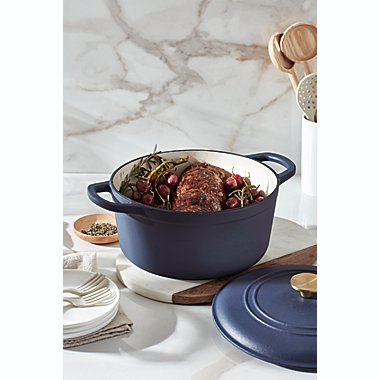 Our Table&trade; 6 qt. Enameled Cast Iron Dutch Oven with Gold Lid Knob in Dark Denim. View a larger version of this product image.