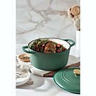 Alternate image 1 for Our Table&trade; 6 qt. Enameled Cast Iron Dutch Oven with Gold Lid Knob in Dark Ivy