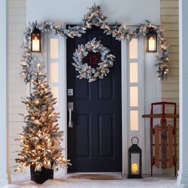 Bee &amp; Willow&trade; Flocked Premium LED Garlands in White (Set of 2). View a larger version of this product image.