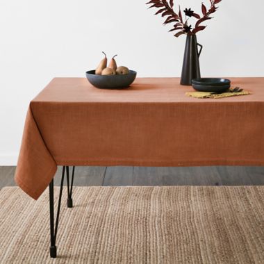 Bee &amp; Willow&trade; Border Stitch 60-Inch x 102-Inch Oblong Tablecloth in Roasted Pecan. View a larger version of this product image.