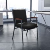 Emma + Oliver Heavy Duty Black Dot Fabric Stack Chair with Arms
