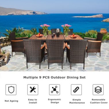 Costway 9 Pieces Patio Rattan Dining Set with Stackable Chairs Cushioned and Acacia Wood Table Top. View a larger version of this product image.