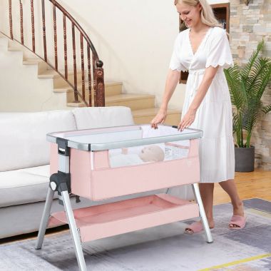 Slickblue Baby Bassinet Bedside Sleeper with Storage Basket and Wheel for Newborn-Pink. View a larger version of this product image.