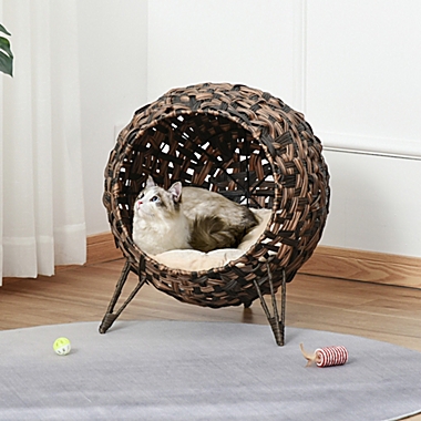PawHut 20.5" Natural Rattan Cat House, Elevated for Comfort and Circulation, Cushion Included as Animal Bed, Brown. View a larger version of this product image.