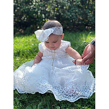 Laurenza&#39;s Baby Girls Sleeveless Baptism Dress Christening Gown with Bow Headband. View a larger version of this product image.