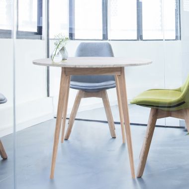 The Bianco Collection Avella 31" Round Italian Carrara White Marble Dining Table with Oak Legs. View a larger version of this product image.