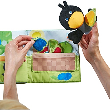 HABA Fabric Book Orchard with Raven Finger Puppet and Removable Fruit. View a larger version of this product image.