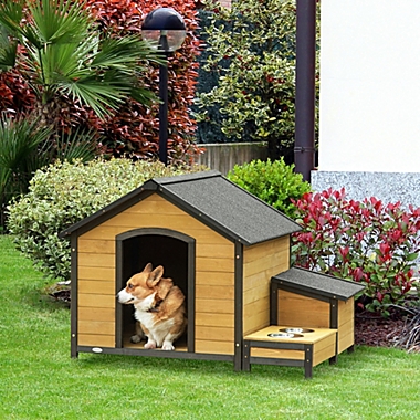 PawHut Wooden Outdoor Dog House, Cabin-Style Pet House with Feeding Bowls, Asphalt Roof, Storage Box for Dogs Up To 66 Lbs., Natural. View a larger version of this product image.
