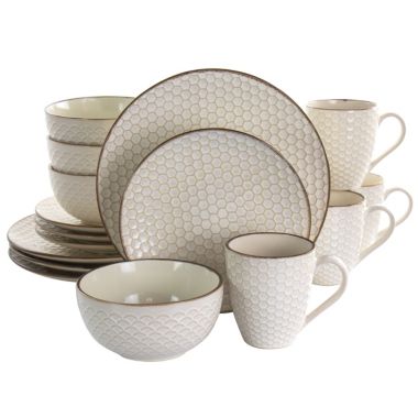 Elama Honey Ivory 16 Piece Stoneware Dinnerware Set in Ivory. View a larger version of this product image.