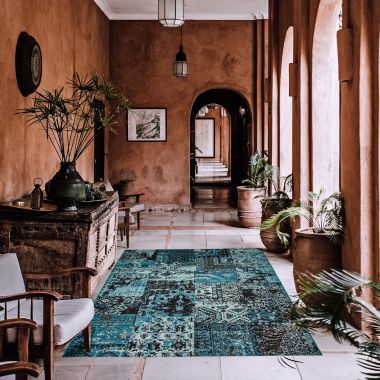 Chaudhary Living 6.5' x 9.5' Blue and Black Distressed Patchwork Rectangular Area Throw Rug. View a larger version of this product image.