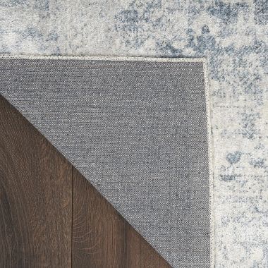 Nourison Astra Machine Washable Vintage Persian Indoor Rug Blue/Ivory 7'10" x 10'. View a larger version of this product image.