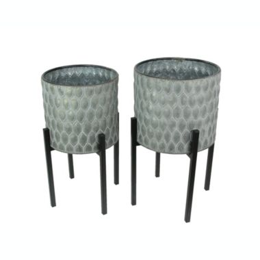 Napco Imports Set of 2 Galvanized Zinc Finish Leaf Pattern Stamped Metal Planters With Wooden Stands. View a larger version of this product image.