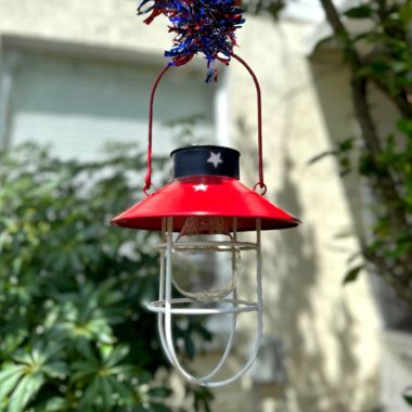 Direct International Rustic Metal Hanging Patriotic LED Solar Light Indoor Outdoor Accent Patio Decor. View a larger version of this product image.